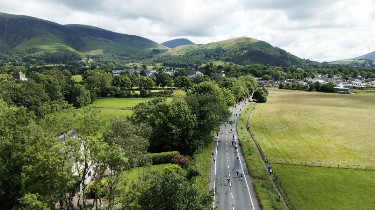 Flat lapped run course with mountain backdrop