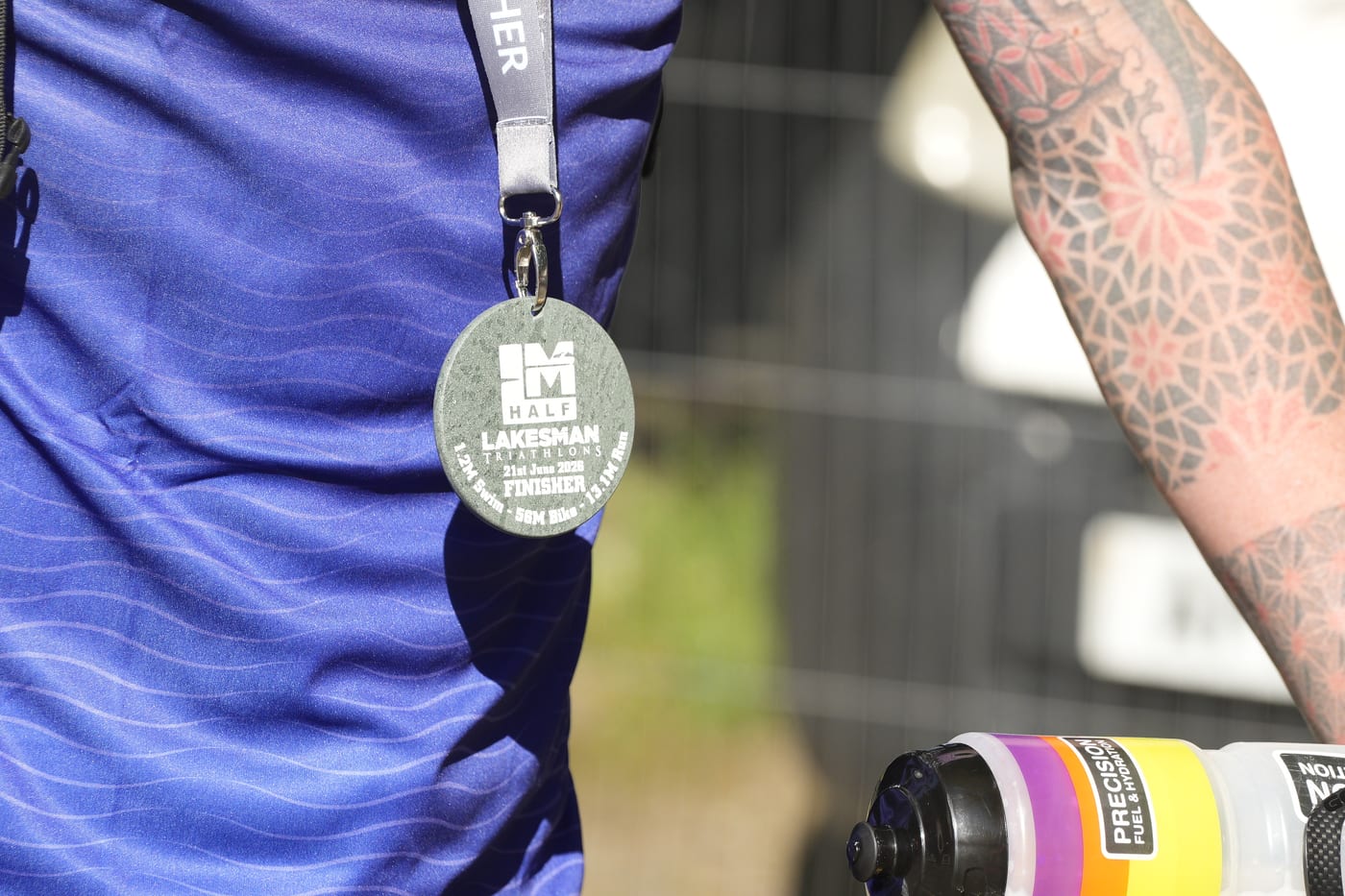 Close-up of a Lakesman finisher medal