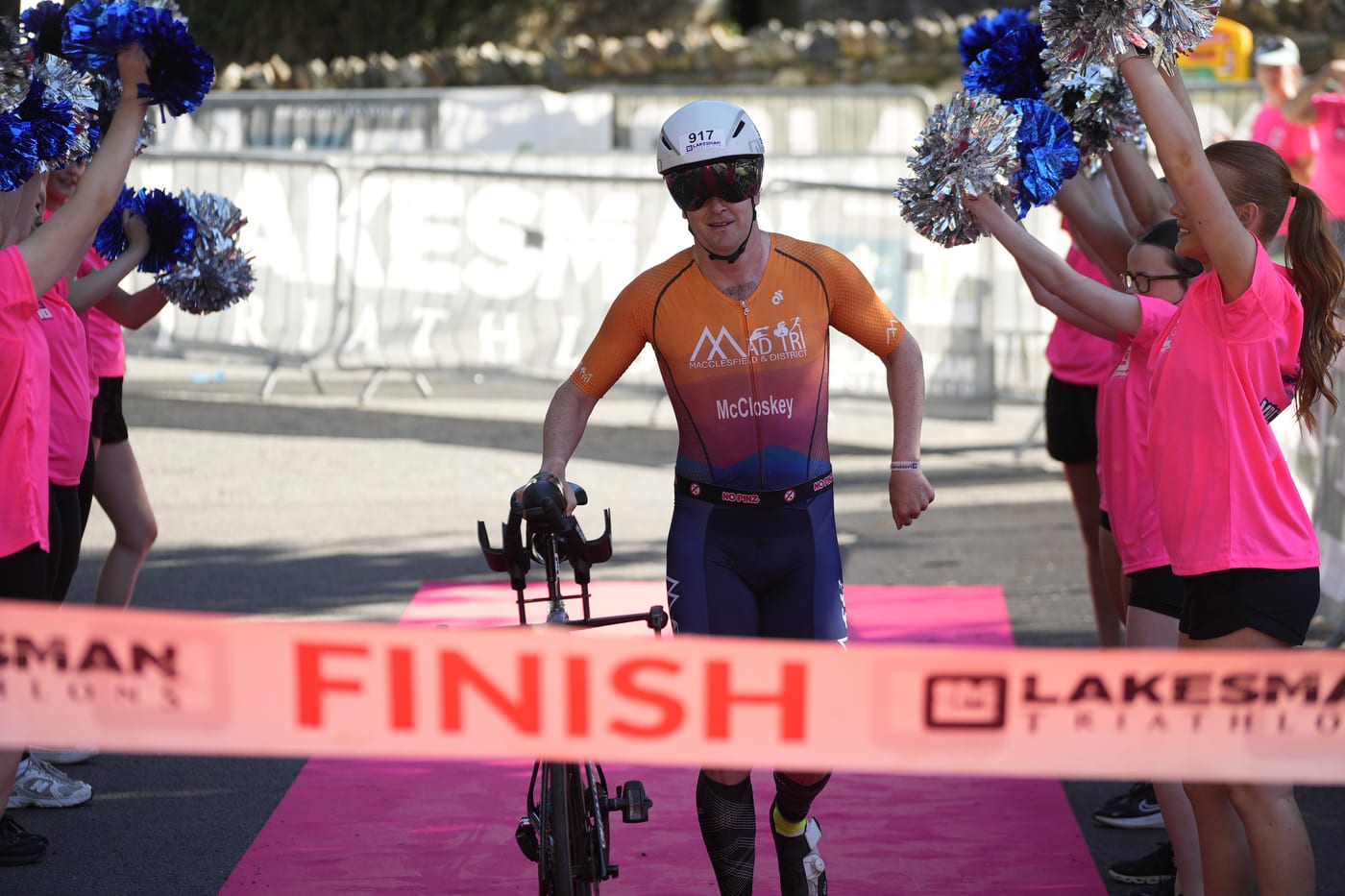 Athlete crossing the Lakesman finish line