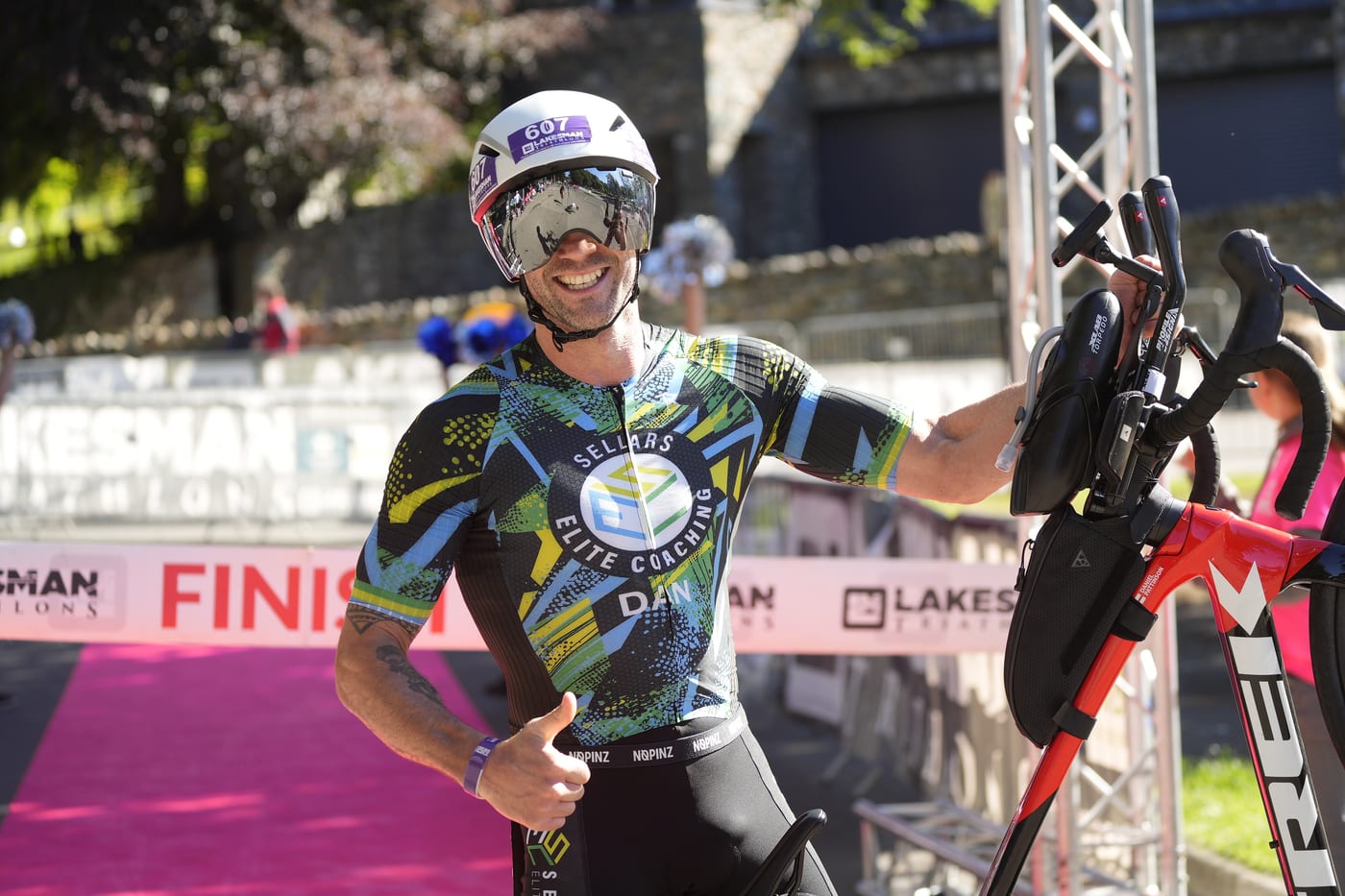 Athlete celebrating as they cross the Lakesman finish line