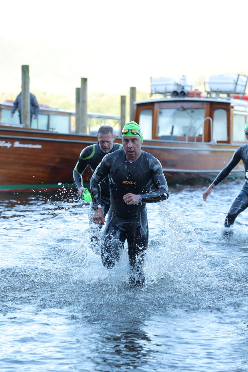 Swimmer exiting the water at the Lakesman swim start
